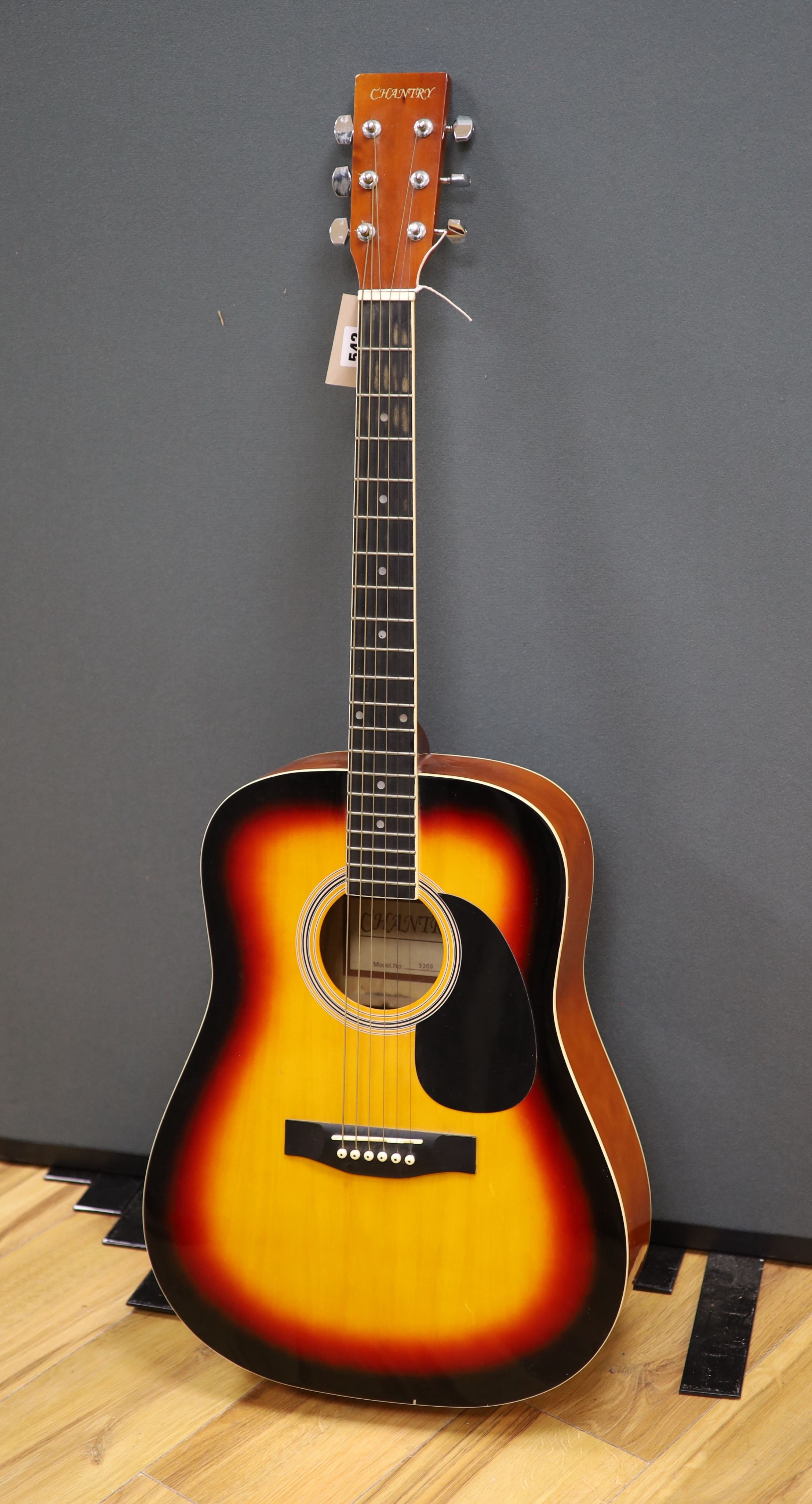 A Chantry Sunburst acoustic guitar